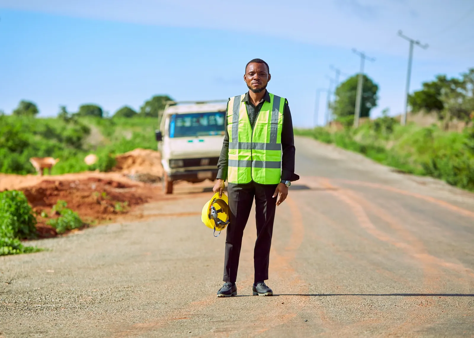 Field worker on a rural road, library photograph